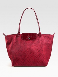 Lightweight ostrich print nylon with rich crocodile embossed leather trim, great for travel and everyday use.Double crocodile embossed leather top handles, 9 dropTop zip closure with snap flapOne inside open pocketFully lined19½W X 12H X 7½DImported Lightweight ostrich print nylon with rich crocodile embossed leather trim, great for travel and everyday use.Double crocodile embossed leather top handles, 9 dropTop zip closure with snap flapOne inside open pocketFully lined19½W X 12H X 7½DImported