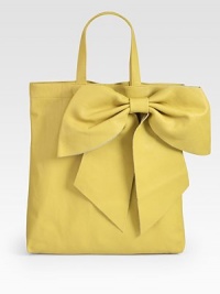 Italian leather in a classic silhouette, sweetened by an oversized bow. Double top handles, 6 dropMagnetic snap closureOne inside zip pocket14W X 15H X 2DMade in Italy Italian leather in a classic silhouette, sweetened by an oversized bow. Double top handles, 6 dropMagnetic snap closureOne inside zip pocket14W X 15H X 2DMade in Italy