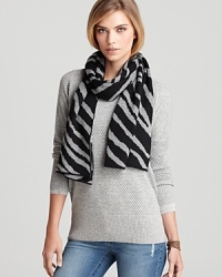Keep your cold weather style young, wild and free in this zebra-print, oblong scarf from Aqua. Keep your cold weather style young, wild and free in this zebra-print, oblong scarf from Aqua.