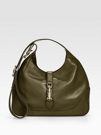 Leather shoulder bag with a single adjustable strap and metal piston closure.Adjustable shoulder strap, 8¾-19¾ drop Metal piston strap closure Inside zip, cell phone and PDA pockets Linen lining 13W X 8¾H X 2¾D Made in Italy Leather shoulder bag with a single adjustable strap and metal piston closure.Adjustable shoulder strap, 8¾-19¾ drop Metal piston strap closure Inside zip, cell phone and PDA pockets Linen lining 13W X 8¾H X 2¾D Made in Italy
