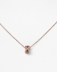 With a crystal-encrusted knot pendant, Chrislu's understated rose gold chain adds a delicate shot of sparkle to any look. Show it off against a dramatic neckline. With a crystal-encrusted knot pendant, Chrislu's understated rose gold chain adds a delicate shot of sparkle to any look. Show it off against a dramatic neckline.