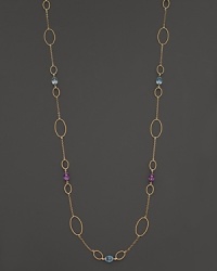 Faceted oval amethyst and blue topaz add rich sparkle to 14K yellow gold. By Nancy B. Faceted oval amethyst and blue topaz add rich sparkle to 14K yellow gold. By Nancy B.
