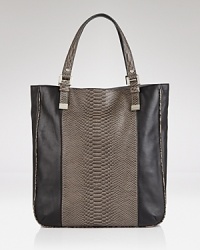 Be the envy of your friends with this tactile tote from Juicy Couture. It flaunts a carry-it-all shape that looks extra luxe in rich leather. Be the envy of your friends with this tactile tote from Juicy Couture. It flaunts a carry-it-all shape that looks extra luxe in rich leather.