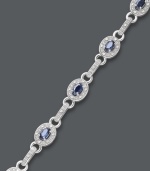 Royal sophistication. This oval link bracelet shines with the addition of oval-cut sapphires (2-5/8 ct. t.w.) and round-cut diamonds (1/4 ct. t.w.). Set in sterling silver. Approximate length: 7-1/2 inches.