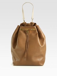 A modern and sleek design in luxurious leather with radiant hardware and a chic drawstring closure.Detachable top handle, 8 dropAdjustable shoulder straps, 3-13 dropDrawstring closureProtective metal feetOne inside zip pocketTwo inside open pocketsOne mirrorLeather lining10½W X 15H X 6½DMade in USA A modern and sleek design in luxurious leather with radiant hardware and a chic drawstring closure.Detachable top handle, 8 dropAdjustable shoulder straps, 3-13 dropDrawstring closureProtective metal feetOne inside zip pocketTwo inside open pocketsOne mirrorLeather lining10½W X 15H X 6½DMade in USA