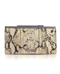 An eye-catching design from Kenneth Cole Reaction, featuring a fun python print and sleek metallic accents. Add wow-factor to any day or night look with this gorgeous frame clutch. An eye-catching design from Kenneth Cole Reaction, featuring a fun python print and sleek metallic accents. Add wow-factor to any day or night look with this gorgeous frame clutch.