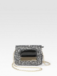 Be the star of the party in this textured, glitter fabric design with patent leather trim and detachable strap.Detachable chain shoulder strap, 23½ dropTop zip closure with flapSatin lining5W X 3½H X 2DMade in Italy Be the star of the party in this textured, glitter fabric design with patent leather trim and detachable strap.Detachable chain shoulder strap, 23½ dropTop zip closure with flapSatin lining5W X 3½H X 2DMade in Italy