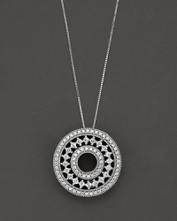 A delicate filigree circle pendant, encrusted with diamonds in 14 Kt. white gold. A delicate filigree circle pendant, encrusted with diamonds in 14 Kt. white gold.