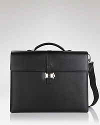 Crafted from black southern German full-grain calfskin, this triple-gusset briefcase is sleek fully loaded with pockets, for your PDA, 2 writing instruments, and small and medium documents. Crafted from black southern German full-grain calfskin, this triple-gusset briefcase is sleek fully loaded with pockets, for your PDA, 2 writing instruments, and small and medium documents.