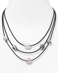 Softly glowing manmade pearls stylishly punctuate this triple-strand leather necklace from Majorica. Softly glowing manmade pearls stylishly punctuate this triple-strand leather necklace from Majorica.
