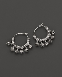 Inspired by Zen philosophy, these hoop earrings from Paul Morelli feature intricately detailed sterling silver meditation bells. Inspired by Zen philosophy, these hoop earrings from Paul Morelli feature intricately detailed sterling silver meditation bells.