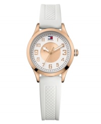 Punctuality gets pretty with this glammed up sport watch by Tommy Hilfiger. White textured silicone strap and round rose-gold-plated stainless steel case. Double-layered white and rose-gold tone dial features cut-out numerals, black minute track, flag logo at twelve o'clock and three hands with rose-gold tone accents. Quartz movement. Water resistant to 30 meters. Ten-year limited warranty. Punctuality gets pretty with this glammed up sport watch by Tommy Hilfiger. White textured silicone strap and round rose-gold-plated stainless steel case. Double-layered white and rose-gold tone dial features cut-out numerals, black minute track, flag logo at twelve o'clock and three hands with rose-gold tone accents. Quartz movement. Water resistant to 30 meters. Ten-year limited warranty.