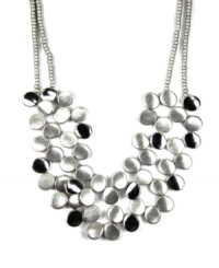 Do a double take! Necklace by Jones New York features a two-row design that makes a stylish statement with polished, circular discs. Setting and chain crafted in silver tone mixed metal. Approximate length: 17 inches. Approximate drop: 3 inches. Do a double take! Necklace by Jones New York features a two-row design that makes a stylish statement with polished, circular discs. Setting and chain crafted in silver tone mixed metal. Approximate length: 17 inches. Approximate drop: 3 inches.