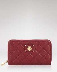 Pull off the posh, pretty, and practical look with this leather wallet from Marc Jacobs. Crafted from quilted leather and accented with the brand's signature hardware, it's an essential no fashion girl should be without. Pull off the posh, pretty, and practical look with this leather wallet from Marc Jacobs. Crafted from quilted leather and accented with the brand's signature hardware, it's an essential no fashion girl should be without.