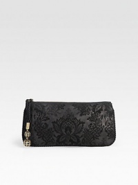 An elegant mix of brushed leather and suede in an intricate brocade design accented with corded trim and an embellished zipper pull.Top zip closureEmbellished zipper pullOne inside open pocketLeather lining10W X 5H X ½DMade in Italy An elegant mix of brushed leather and suede in an intricate brocade design accented with corded trim and an embellished zipper pull.Top zip closureEmbellished zipper pullOne inside open pocketLeather lining10W X 5H X ½DMade in Italy