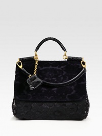 A beautiful blend of velvet, sequins, cotton lace and snakeskin in a roomy carryall design.Snakeskin top handle, 5½ dropDetachable snakeskin shoulder strap, 9 dropMagnetic snap flap closureMagnetic snap gussetsDetachable snakeskin coin pouchOne inside zip pocketTwo inside open pocketsCotton lining13W X 11½H X 6DMade in Italy A beautiful blend of velvet, sequins, cotton lace and snakeskin in a roomy carryall design.Snakeskin top handle, 5½ dropDetachable snakeskin shoulder strap, 9 dropMagnetic snap flap closureMagnetic snap gussetsDetachable snakeskin coin pouchOne inside zip pocketTwo inside open pocketsCotton lining13W X 11½H X 6DMade in Italy