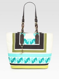 Be ready for summer days with this roomy carryall of luxe canvas, featuring a bright geometric print and sleek leather top handles. Double leather and chain top handles, 11¼ dropMagnetic snap closureProtective metal feetOne inside zip pocketTwo inside open pocketsFully lined13W X 12¾H X 6¼DImported Be ready for summer days with this roomy carryall of luxe canvas, featuring a bright geometric print and sleek leather top handles. Double leather and chain top handles, 11¼ dropMagnetic snap closureProtective metal feetOne inside zip pocketTwo inside open pocketsFully lined13W X 12¾H X 6¼DImported