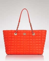 With a classic shape and bold hue, kate spade new york's quilted leather tote has been designed for high-impact accessorizing. Carry it to give your Monday through Sunday look a burst of color. With a classic shape and bold hue, kate spade new york's quilted leather tote has been designed for high-impact accessorizing. Carry it to give your Monday through Sunday look a burst of color.