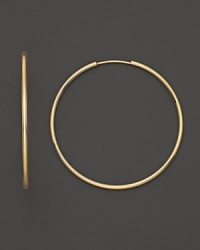 Simply chic, these 14K. yellow gold hoops are timeless classics. Simply chic, these 14K. yellow gold hoops are timeless classics.