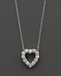 From the Tiny Treasures collection, a diamond heart necklace with signature ruby accent. Designed by Roberto Coin. From the Tiny Treasures collection, a diamond heart necklace with signature ruby accent. Designed by Roberto Coin.