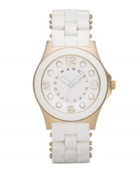 Cool as ice and just a little nice. Marc by Marc Jacobs adds a touch of luxe gold to this Pelly watch for warmth. White silicone-wrapped stainless steel bracelet with gold ion-plated accents and round gold ion-plated case. White dial features logo, numerals at twelve, three, six and nine o'clock and dot markers. Quartz movement. Water resistant to 30 meters. Two-year limited warranty. Cool as ice and just a little nice. Marc by Marc Jacobs adds a touch of luxe gold to this Pelly watch for warmth. White silicone-wrapped stainless steel bracelet with gold ion-plated accents and round gold ion-plated case. White dial features logo, numerals at twelve, three, six and nine o'clock and dot markers. Quartz movement. Water resistant to 30 meters. Two-year limited warranty.