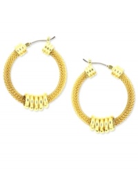 Add some texture to a classic look. Anne Klein's hoop earrings shake things up with textured mesh and shiny accents. Crafted in gold tone mixed metal. Approximate diameter: 2-1/2 inches. Add some texture to a classic look. Anne Klein's hoop earrings shake things up with textured mesh and shiny accents. Crafted in gold tone mixed metal. Approximate diameter: 2-1/2 inches.