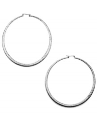 Amp it up, says RACHEL Rachel Roy! The bigger, the bolder, the better is always the way to go when it comes to hoop earrings. Crafted in silver tone mixed metal with a click backing. Approximate diameter: 3 inches.