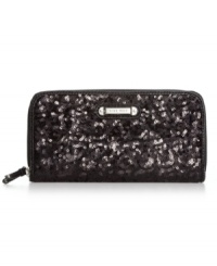 Every girl needs a little glamour on-the-go, and this shimmery sequin-embellished wallet from Nine West is the perfect choice. The slim design discretely slips into your bag, while plenty of interior pockets safely stow cards, cash, coins and ID without a worry. Every girl needs a little glamour on-the-go, and this shimmery sequin-embellished wallet from Nine West is the perfect choice. The slim design discretely slips into your bag, while plenty of interior pockets safely stow cards, cash, coins and ID without a worry.