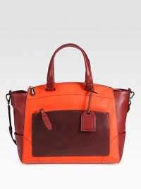 Luxurious pebbled leather in a chic, colorblocked design with a soft shape and a versatile, detachable strap.Double top handles, 7 dropDetachable shoulder strap, 15 dropTop zip closureProtective metal feetOne outside zip pocketThree outside open pocketsOne inside zip pocketTwo inside open pocketsCotton lining14½W X 12H X 6½DMade in Italy Luxurious pebbled leather in a chic, colorblocked design with a soft shape and a versatile, detachable strap.Double top handles, 7 dropDetachable shoulder strap, 15 dropTop zip closureProtective metal feetOne outside zip pocketThree outside open pocketsOne inside zip pocketTwo inside open pocketsCotton lining14½W X 12H X 6½DMade in Italy