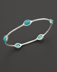 From the Silver collection, five turquoise stations on a sterling silver oval bangle. Designed by Ippolita. From the Silver collection, five turquoise stations on a sterling silver oval bangle. Designed by Ippolita.