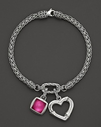 An intricately woven sterling silver chain holds a bamboo heart charm and a doublet gem of white quartz and pink rubelite corundum. An intricately woven sterling silver chain holds a bamboo heart charm and a doublet gem of white quartz and pink rubelite corundum.
