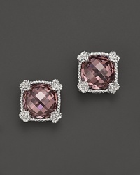 Brilliant raspberry crystal is framed in sterling silver on these timeless Judith Ripka studs. Brilliant raspberry crystal is framed in sterling silver on these timeless Judith Ripka studs.