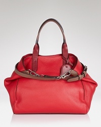 City style meets functionality. This Cole Haan tote is an effortless on-the-town essential, crafted of leather with sleek, carry-it-all proportions. City style meets functionality. This Cole Haan tote is an effortless on-the-town essential, crafted of leather with sleek, carry-it-all proportions.