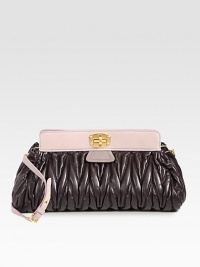 This quilted leather style is accented with contrast trim and a detachable shoulder strap.Detachable adjustable shoulder strap, 18½-20½ dropTurnlock closureThree inner compartmentsTwo inside zip pocketsTwo inside open pocketsSatin lining16W X 8H X 6DMade in Italy This quilted leather style is accented with contrast trim and a detachable shoulder strap.Detachable adjustable shoulder strap, 18½-20½ dropTurnlock closureThree inner compartmentsTwo inside zip pocketsTwo inside open pocketsSatin lining16W X 8H X 6DMade in Italy