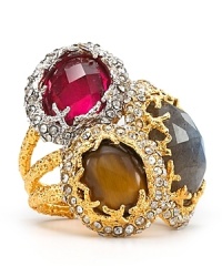 Gold plated metal on this Alexis Bittar ring surrounds a trio of stacked stones featuring a brilliant play of light-enhanced colors. Gold plated metal on this Alexis Bittar ring surrounds a trio of stacked stones featuring a brilliant play of light-enhanced colors.