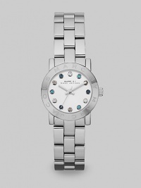 A sleek stainless steel style with multicolored stone markers for a pop of color. Quartz movementWater resistant to 5 ATMRound stainless steel case, 26mm (1)Logo etched bezelSilver dialMulticolored glass stone hour markersSecond hand Stainless steel link braceletImported A sleek stainless steel style with multicolored stone markers for a pop of color. Quartz movementWater resistant to 5 ATMRound stainless steel case, 26mm (1)Logo etched bezelSilver dialMulticolored glass stone hour markersSecond hand Stainless steel link braceletImported