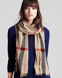 Burberry perfection: wrap up your look in this gauzy scarf with a stand-out, oversized take on signature plaid. It's an instant, cutting-edge classic. Burberry perfection: wrap up your look in this gauzy scarf with a stand-out, oversized take on signature plaid. It's an instant, cutting-edge classic.