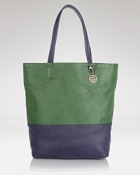 Join the color block party with this leather tote from DKNY. Luxurious and spacious, this tone on tone style is a must-have companion for busy days in the city. Join the color block party with this leather tote from DKNY. Luxurious and spacious, this tone on tone style is a must-have companion for busy days in the city.