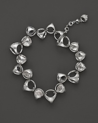 A bold sterling silver bracelet, gleaming with rock crystal, is an elegant showcase for Di MODOLO's iconic Triadra design. A bold sterling silver bracelet, gleaming with rock crystal, is an elegant showcase for Di MODOLO's iconic Triadra design.