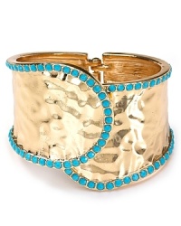Nail this season's eclectic jewelry trend with this gleaming cuff from Cara. Crafted from metal plate with turquoise colored stones, this bohemian piece will work just as well for day as for night. Nail this season's eclectic jewelry trend with this gleaming cuff from Cara. Crafted from metal plate with turquoise colored stones, this bohemian piece will work just as well for day as for night.