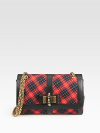 A mix of traditional plaid cotton with calfskin trim, bow detail and goldtone hardware.Double or single chain shoulder strap, 12½-22 dropPush-lock flap closureTwo open pockets under flapOne inside zip pocketOne inside open pocketSignature red lining10W X 6½H X 3DMade in Italy A mix of traditional plaid cotton with calfskin trim, bow detail and goldtone hardware.Double or single chain shoulder strap, 12½-22 dropPush-lock flap closureTwo open pockets under flapOne inside zip pocketOne inside open pocketSignature red lining10W X 6½H X 3DMade in Italy