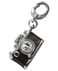 Picture this. Fossil's camera charm, crafted from silver-tone mixed metal and chocolate brown leather, features glass crystal details to capture the moment. Approximate length (charm): 7/8 inch; (clip): 1/2 inch. Picture this. Fossil's camera charm, crafted from silver-tone mixed metal and chocolate brown leather, features glass crystal details to capture the moment. Approximate length (charm): 7/8 inch; (clip): 1/2 inch.