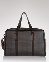 Pack your essentials and travel in style with this reservedly cool, finely crafted bag featuring an allover Gancini pattern from the classic designer Salvatore Ferragamo. Pack your essentials and travel in style with this reservedly cool, finely crafted bag featuring an allover Gancini pattern from the classic designer Salvatore Ferragamo.