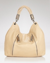 Throw something chic over your shoulder with this exotically accented style from Michael Kors. In rich leather with striking hardware, it's the bag that no outfit should be without. Throw something chic over your shoulder with this exotically accented style from Michael Kors. In rich leather with striking hardware, it's the bag that no outfit should be without.