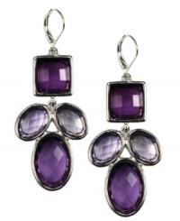 Pretty in purple. AK Anne Klein's bold design highlights a cluster of sparkling purple crystal accents. Crafted in imitation rhodium-plated mixed metal. Approximate drop: 2 inches. Pretty in purple. AK Anne Klein's bold design highlights a cluster of sparkling purple crystal accents. Crafted in imitation rhodium-plated mixed metal. Approximate drop: 2 inches.
