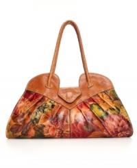 The vintage-inspired Lione satchel showcases angled pleats and embossed floret handles on fine Italian leather in a deeply contoured silhouette. Your choice of classic solid or floral printed. The vintage-inspired Lione satchel showcases angled pleats and embossed floret handles on fine Italian leather in a deeply contoured silhouette. Your choice of classic solid or floral printed.
