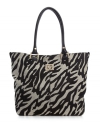 AK Anne Klein goes wild with a zebra stripe to dress up the basic tote purse this season. AK Anne Klein goes wild with a zebra stripe to dress up the basic tote purse this season.