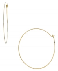 Add a little urban flavor with a whisper-thin pair of hoops. Michael Kors simple, yet stunning, style is crafted in gold tone mixed metal. Approximate diameter: 2-1/4 inches. Add a little urban flavor with a whisper-thin pair of hoops. Michael Kors simple, yet stunning, style is crafted in gold tone mixed metal. Approximate diameter: 2-1/4 inches.