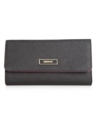 Stay organized anywhere you go with this travel-ready wallet from DKNY that's the right reserve for all your riches. Luxe leather is accented with custom hardware, while the interior is outfitted with plenty of pockets and compartments. Stay organized anywhere you go with this travel-ready wallet from DKNY that's the right reserve for all your riches. Luxe leather is accented with custom hardware, while the interior is outfitted with plenty of pockets and compartments.