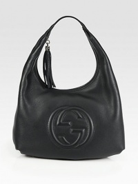 Roomy leather carryall with padded interlocking G and tassels.Shoulder strap, 10 dropZip-top closureOne inside zip pocketOne inside open pocketNatural cotton linen lining18W X 10H X 5DMade in Italy Roomy leather carryall with padded interlocking G and tassels.Shoulder strap, 10 dropZip-top closureOne inside zip pocketOne inside open pocketNatural cotton linen lining18W X 10H X 5DMade in Italy